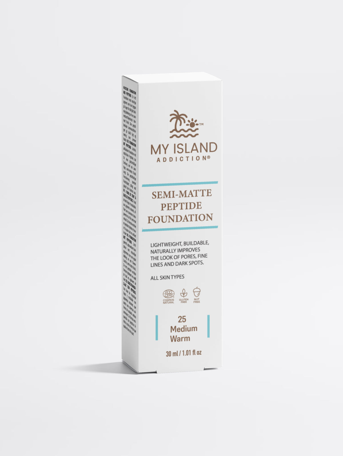 At all white box of My Island Addiction Semi-Matte foundation in shade 25 medium warm in a light background.