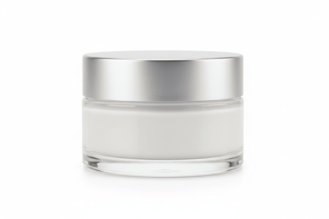 Skincare jar with silver lid on a white background