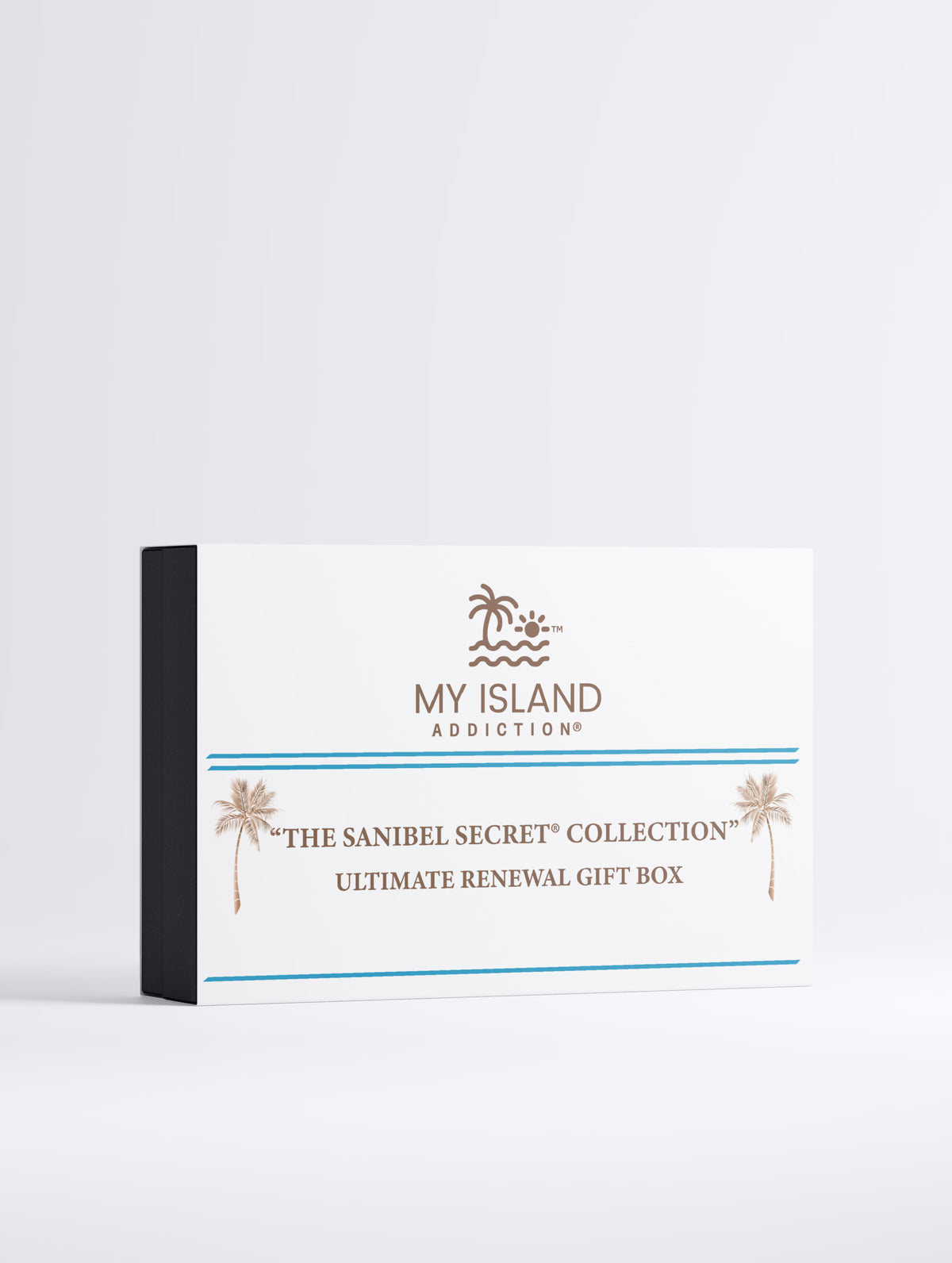 A rectangular gift box for 'My Island Addiction' from 'The Sanibel Secret Collection', featuring a white front with brown palm tree graphics and blue accent lines, set against a clean white background.
